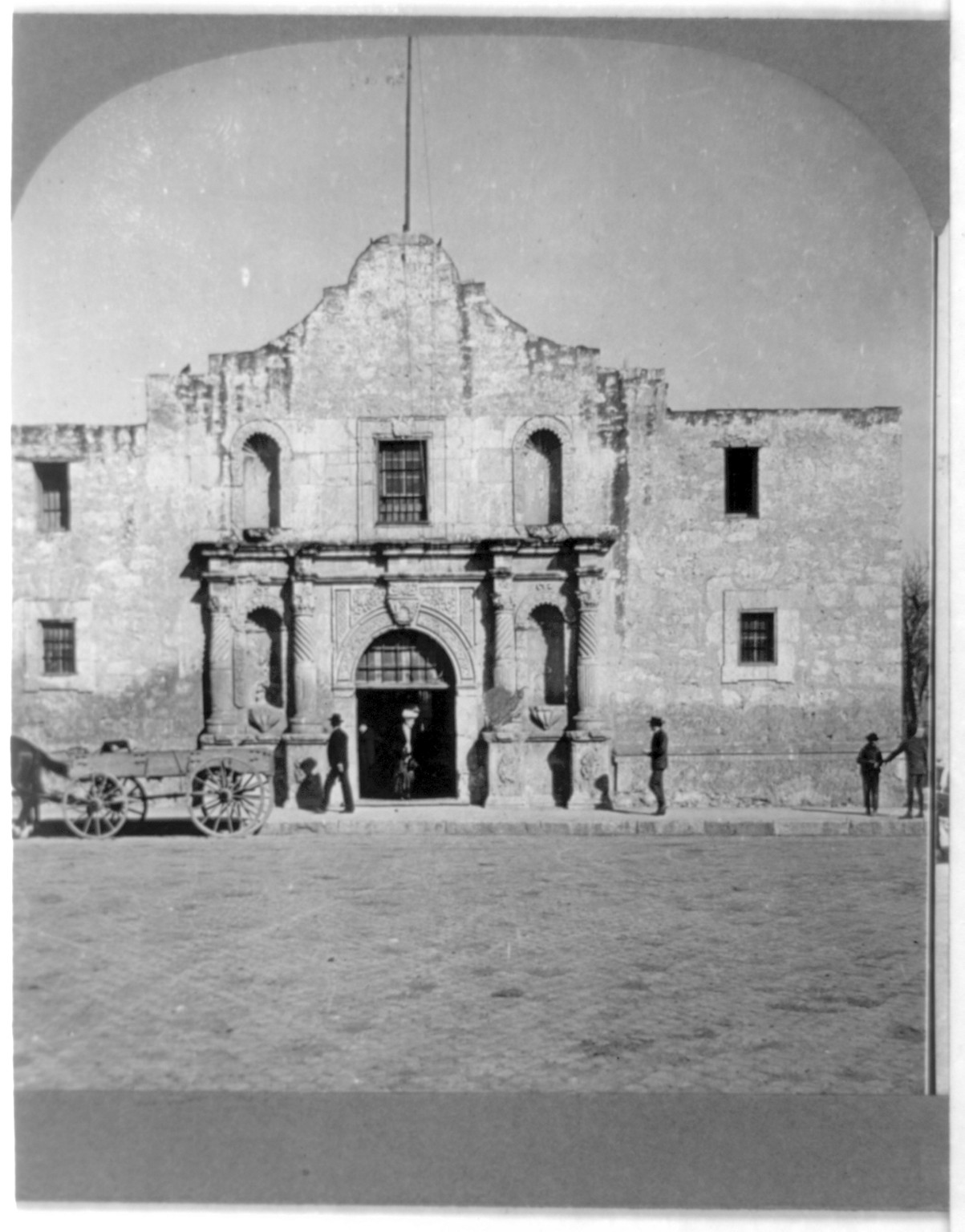 The Alamo facade with figures and a cart, San Antonio, Texas, 1909 — historic image