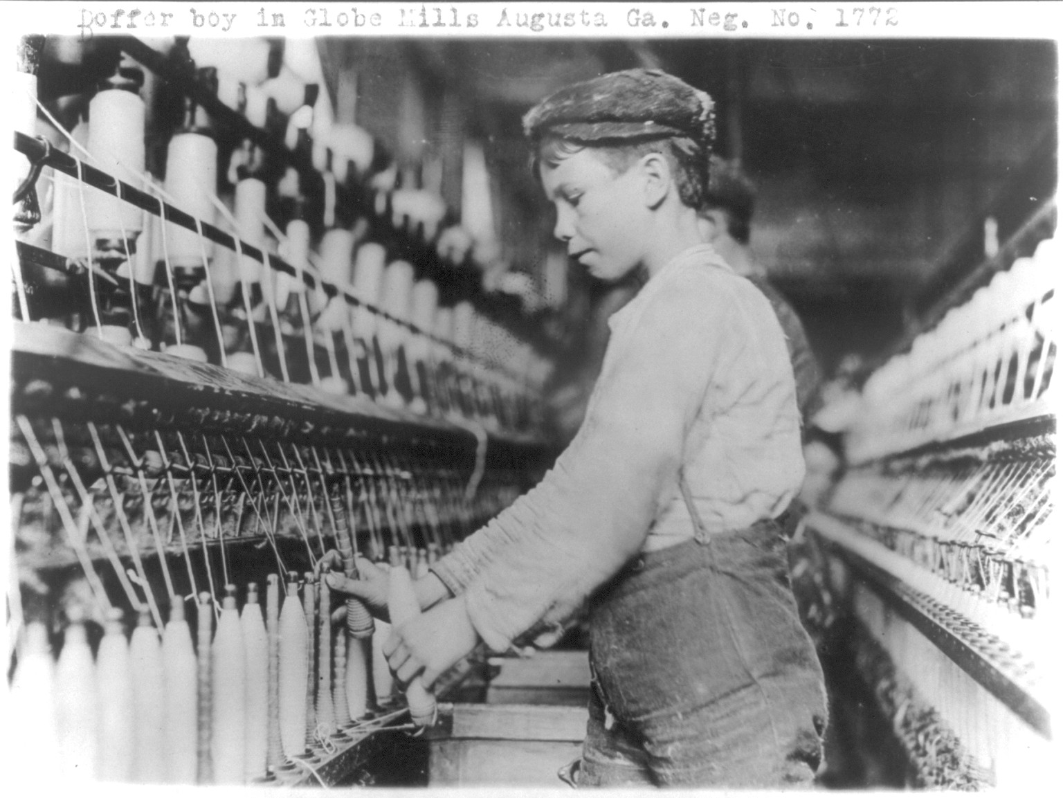 Doffer boy in Globe Mills, Augusta, Ga., [between 1909 and 1932] — historic photograph