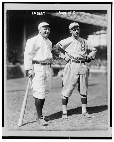 [Baseball players Hans Lobert of the New York Giants (left) and Joe Schultz, Sr. of the Brooklyn Dodgers (right), full-length, standing]