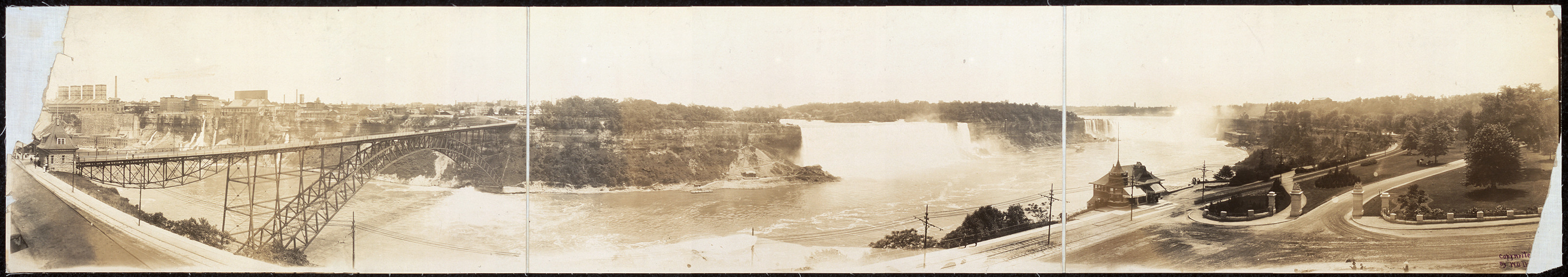 Panoramic view of Niagara Falls and steel arch bridge — historic image