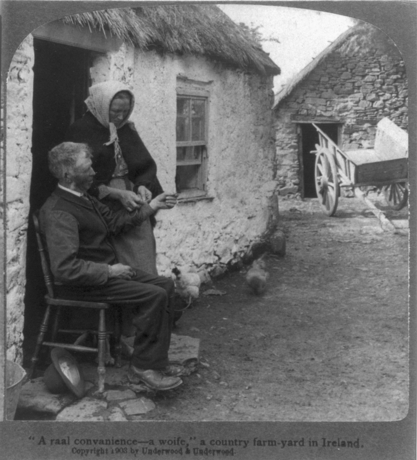 A raal convanience - a woife a country farm-yard in Ireland, c1903. — historic photograph