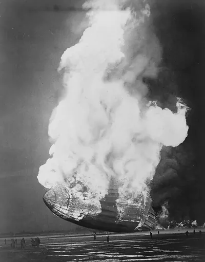 [The Hindenburg hits the ground in flames in Lakehurst, N.J.]