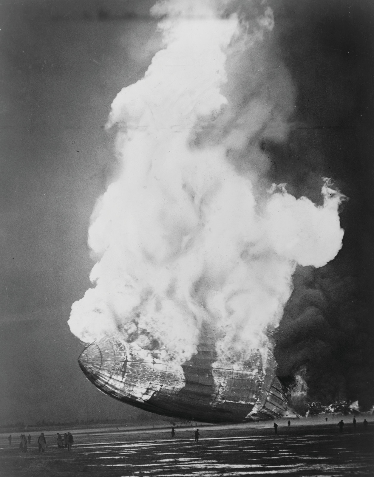 [The Hindenburg hits the ground in flames in Lakehurst, N.J.] — historic photograph