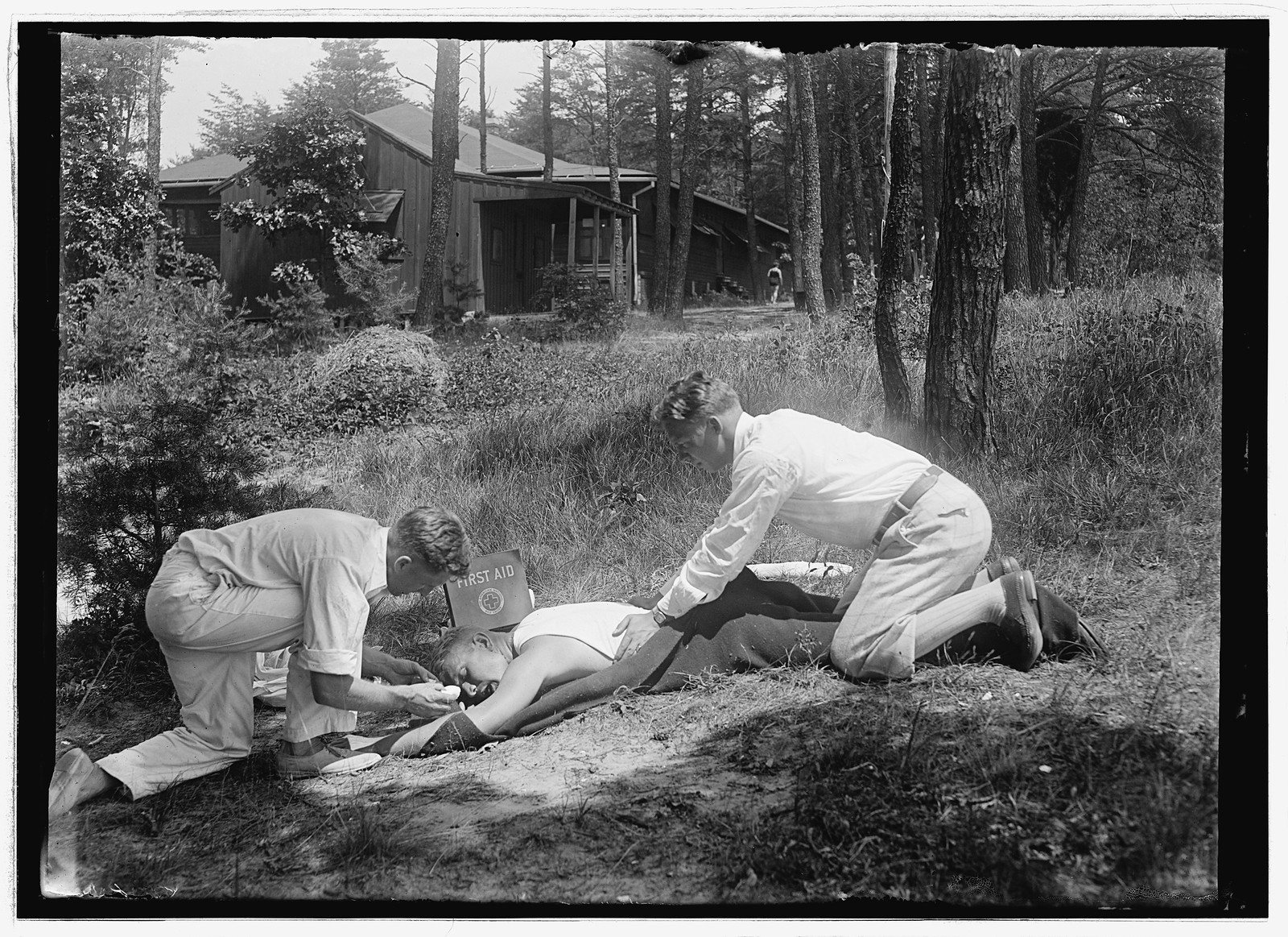 Giving first aid, [between 1912 and 1930] — historic photograph