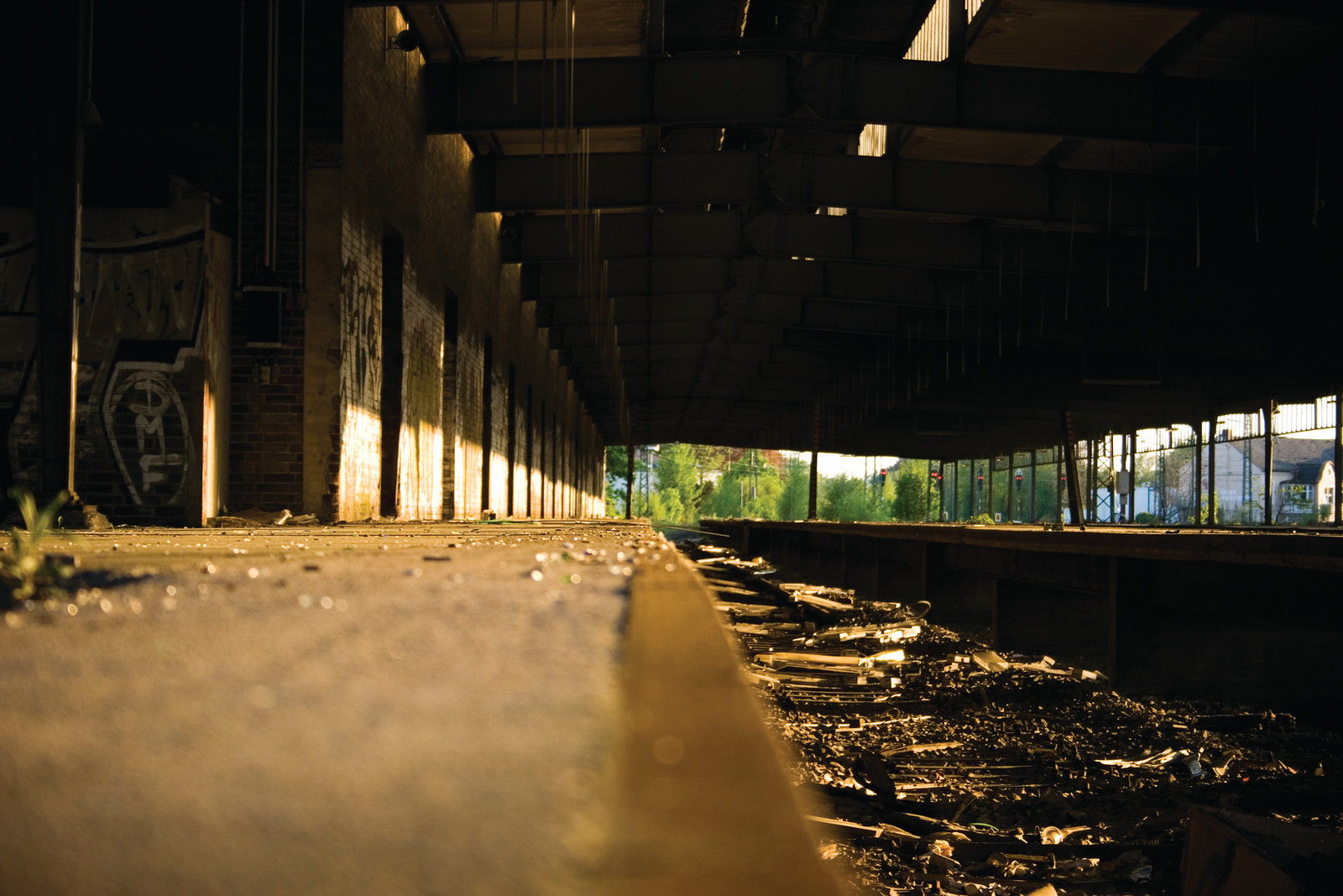 Abandoned industrial hall with concrete platform and debris — historic image