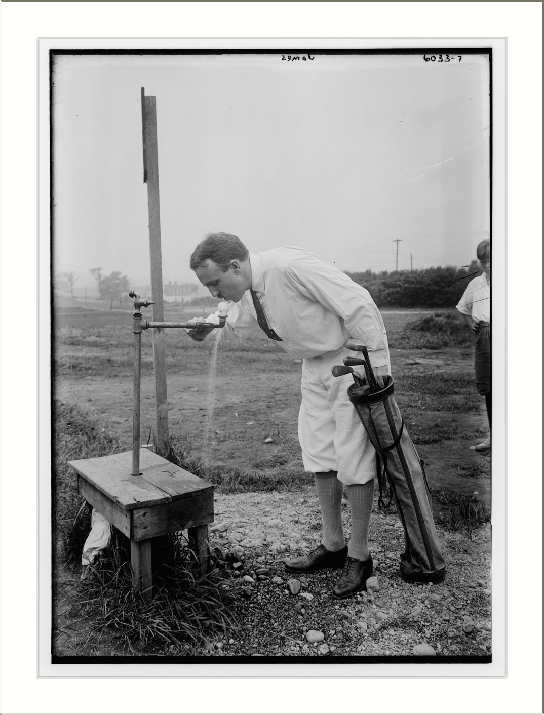 James playing golf, n/a — historic photograph