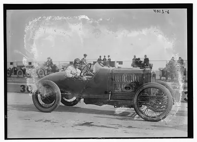 Two men in a racing automobile