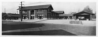 Municipal market building with arched brick facade and open shelters