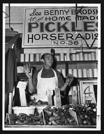 Man selling home-made pickles and horseradish at a market stall